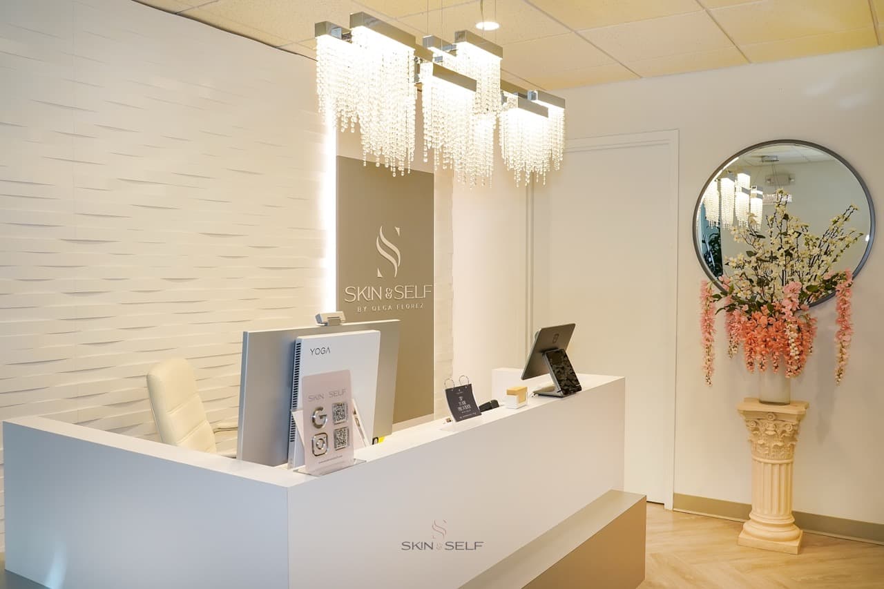 Skin and Self Med Spa lounge in downtown White Plains, NY: chandelier-lit reception with editorial-luxury interior